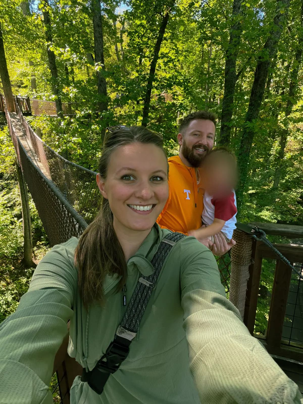 Ben, Rebecca and Caleb on a hiking bridge