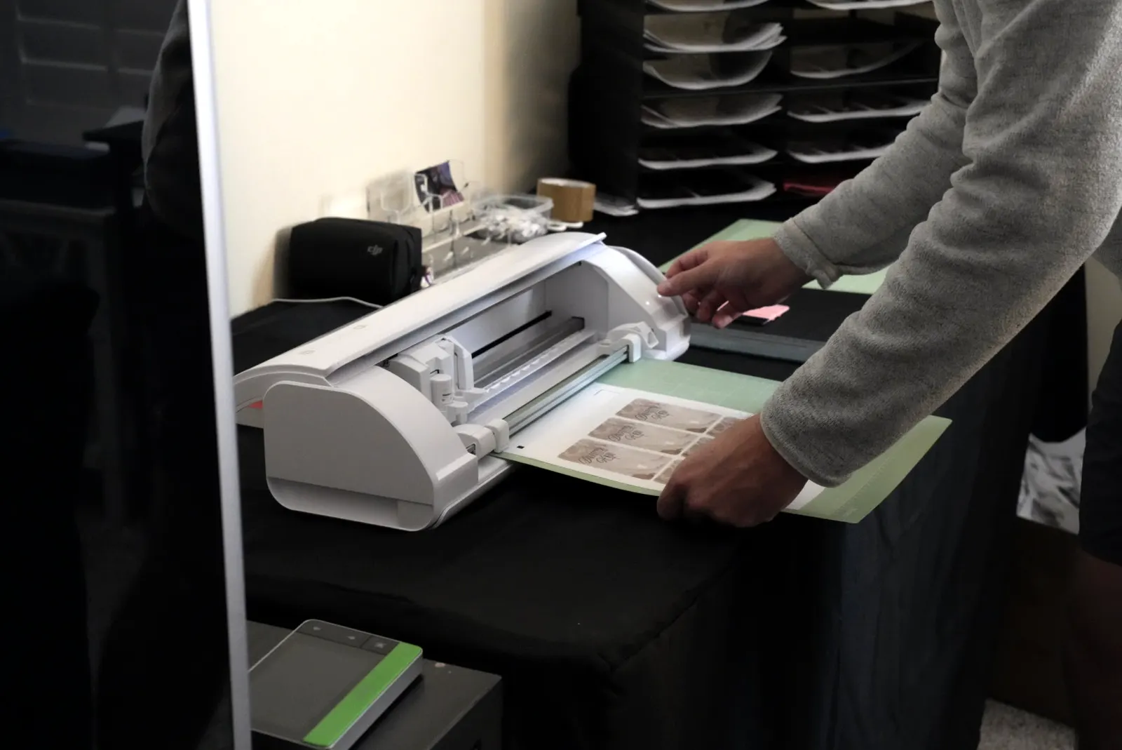Feeding a sheet of skins into our cutter